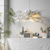 A pendant lighting suspension on a table