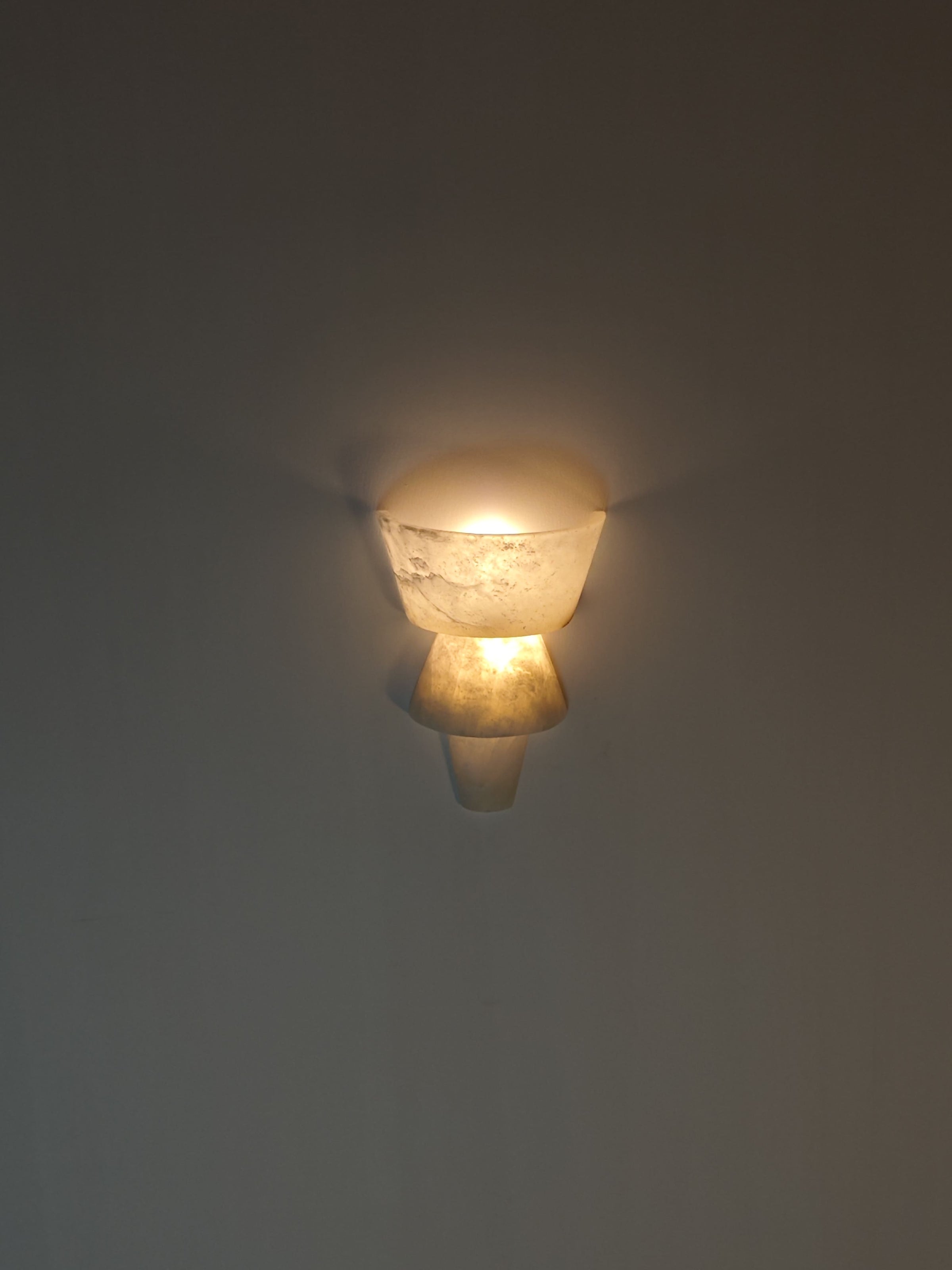 Decorative wall light fixture on a plain wall